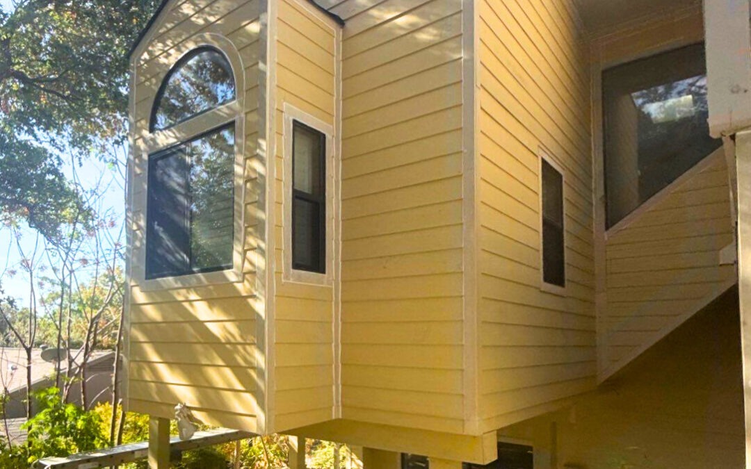 yellow lap siding replacement and painting