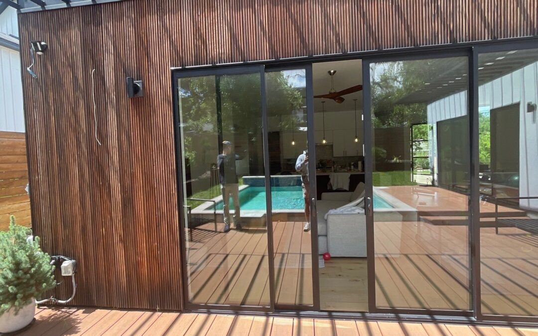 sliding glass doors, wood deck, wood siding