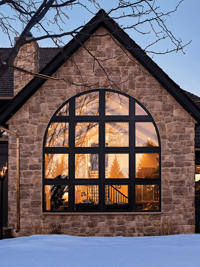 black-arched-window-stone-house arched windows in austin window replacement window installation